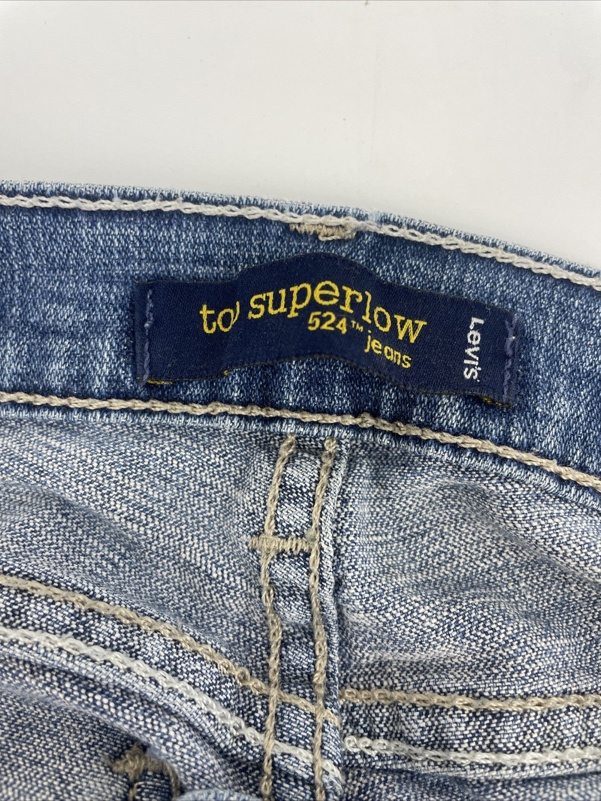 Levis 524 Too Superlow Jeans Women's Size 0M Light Wash Stretch - Worn Tattered