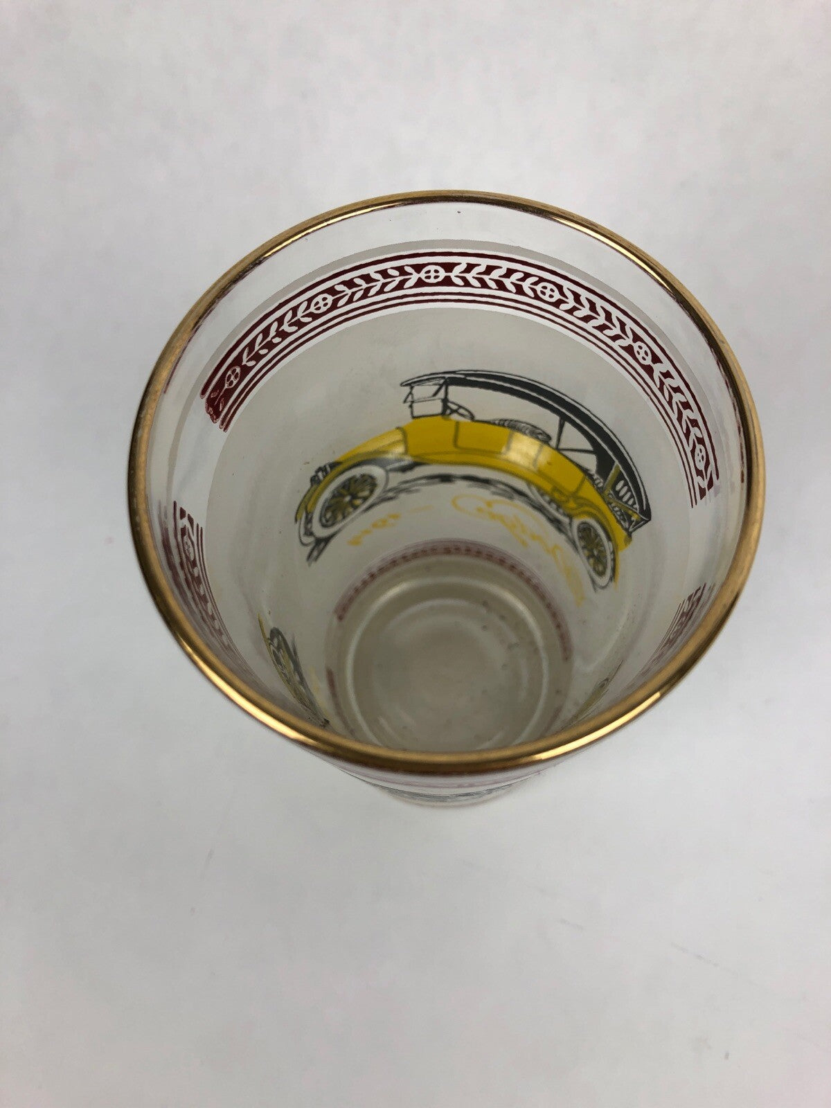 Vintage frosted cocktail glass featuring 1909 Hudson and 1914 Dodge with gold rim.