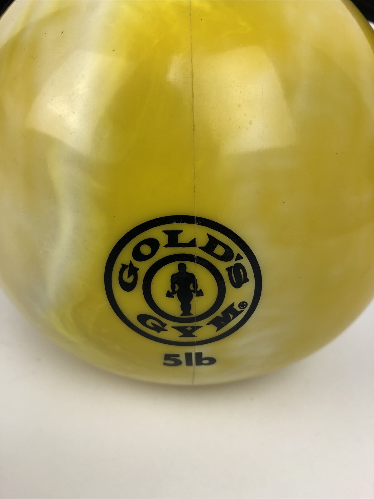 Gold's Gym 5 lb soft weighted medicine ball with handles in black and yellow for home workouts
