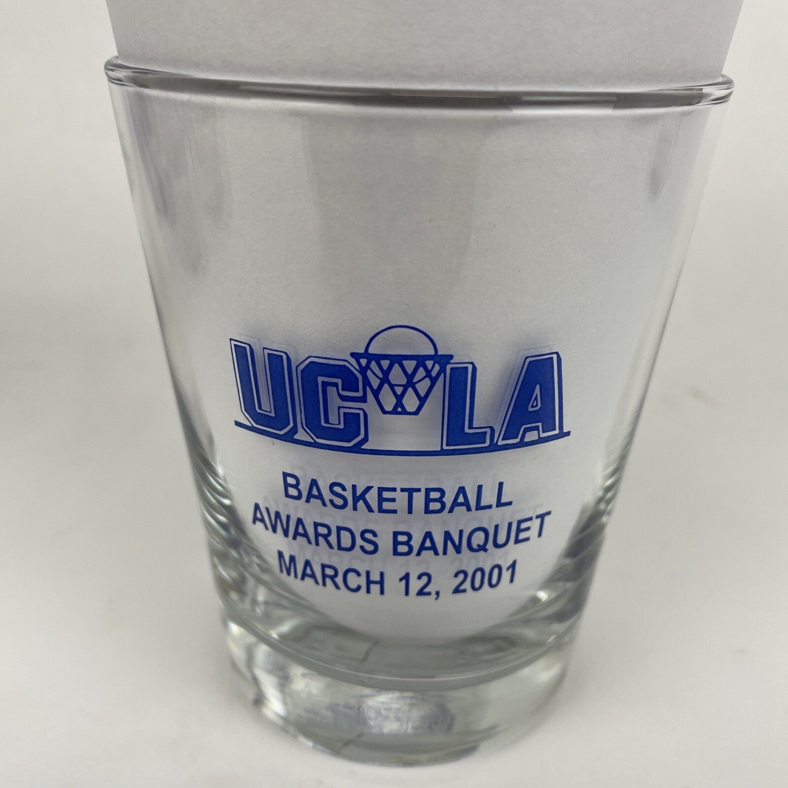Set of three UCLA Bruins Basketball Awards Banquet highball glasses from 2000, 2001, and 2002.