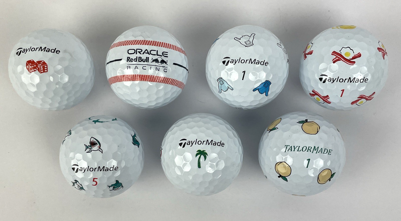 7 TaylorMade TP5x golf balls Oracle Red Bull Shaka Peach Bacon Eggs Palm Shark