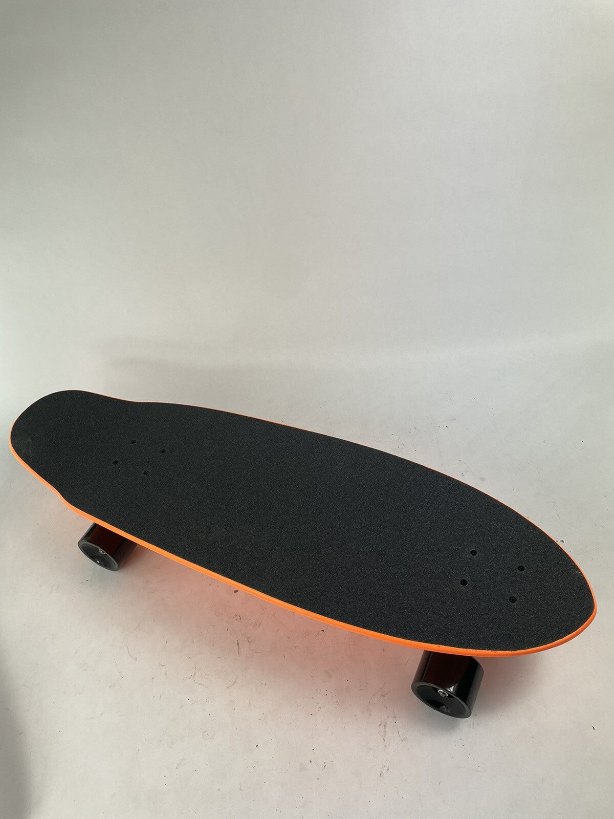 Orange Surf Fish Blank 10-inch complete skateboard with reverse kingpin trucks, 70mm wheels, and ABEC-7 bearings.